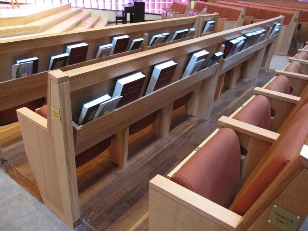 Pew with integrated hymnals